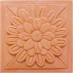 handmade terra cotta ceramic tile with a high relief design and a clear matte or gloss glaze