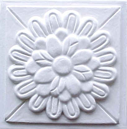 handmade ceramic tile with a high relief design and one color glaze