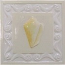 handmade ceramic tile with a high relief shell design and a multi-colored glaze