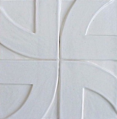 handmade ceramic tile with a high relief design and one color glaze