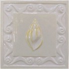 handmade ceramic tile with a high relief shell design and a multi-colored glaze