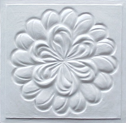 handmade ceramic tile with a high relief design and one color glaze