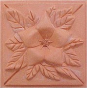 handmade terra cotta ceramic tile with a high relief flower design