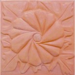 handmade terra cotta ceramic tile with a high relief flower design