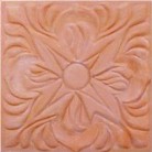 handmade terra cotta  ceramic tile with a high relief design and a clear gloss or matte glaze