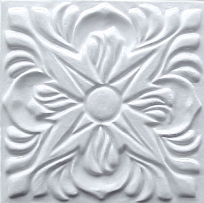 handmade ceramic tile with a high relief design and one color glaze