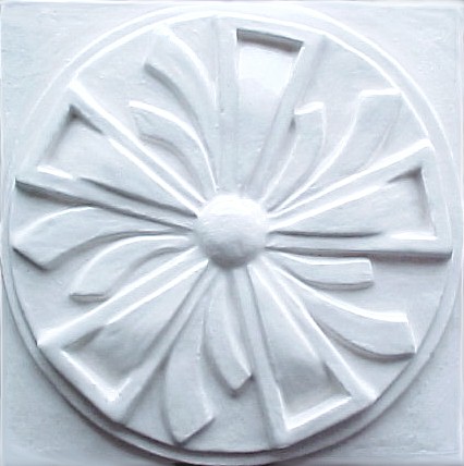 handmade ceramic tile with a high relief design and a one color glaze