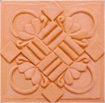 handmade terra cotta ceramic tile with a high relief design and a clear matte or gloss glaze