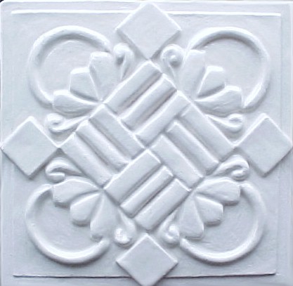 handmade ceramic tile with a high relief design and one color glaze