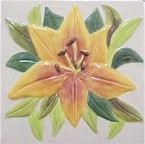 handmade ceramic tile with a high relief flower design and multiple glaze colors