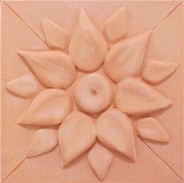 handmade ceramic terra cotta tile with a high relief design and a one color glaze