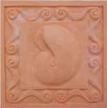 handmade terra cotta ceramic tile with a shell design and a clear gloss or matte glaze