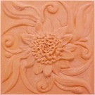 handmade terra cotta ceramic tile with a high relief flower design