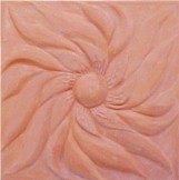 handmade terra cotta ceramic tile with a high relief flower design
