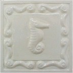 handmade ceramic tile with a high relief shell design and a one color glaze