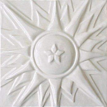 handmade ceramic tile with a high relief design and a one color glaze