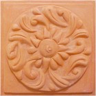 handmade terra cotta ceramic tile with a high relief design and a clear gloss or matte glaze