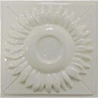 handmade ceramic tile with a high relief flower design and one glaze color