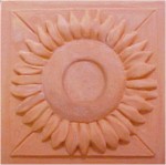 handmade terra cotta ceramic tile with a high relief flower design