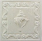 handmade ceramic tile with a high relief shell design and a one colr glaze