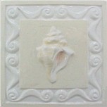 handmade ceramic tile with a high relief shell design and a multi-colored glaze