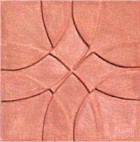 handmade terra cotta ceramic tile with a graphic design and a matte or gloss glaze