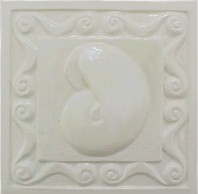 handmade ceramic tile with a high relief design and a one color glaze