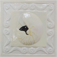 handmade ceramic tile with a high relief shell design and a multi-colored glaze