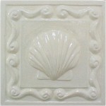 handmade ceramic tile with a high relief shell design and one color glaze