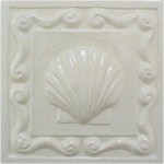 handmade ceramic tile with a high relief shell design and one color glaze