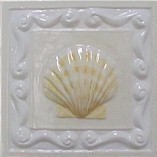 handmade ceramic tile with a high relief shell design and a multi-colored glaze